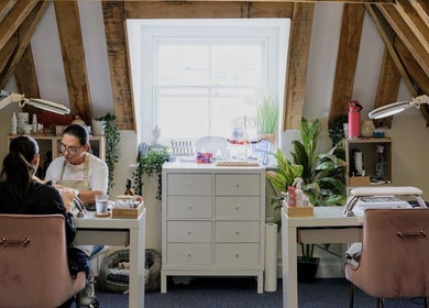 Chic nail service at Cussans Nails & Beauty, Chichester, England, GB. Cozy attic vibe with natural light and wooden beams.