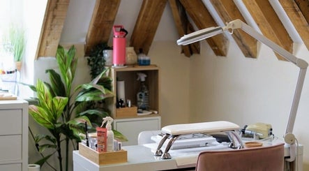 Inviting nail salon interior at Cussans Nails & Beauty, Chichester, England, GB with plants and natural light.