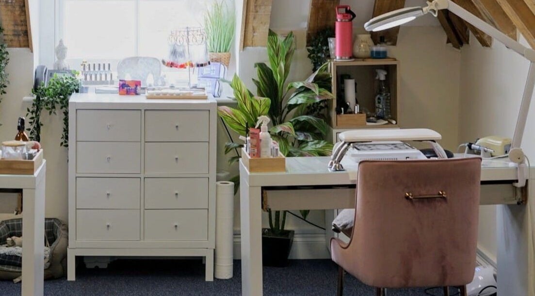 Cozy nail station at Cussans Nails & Beauty, Chichester, England, GB, featuring plants and decor.