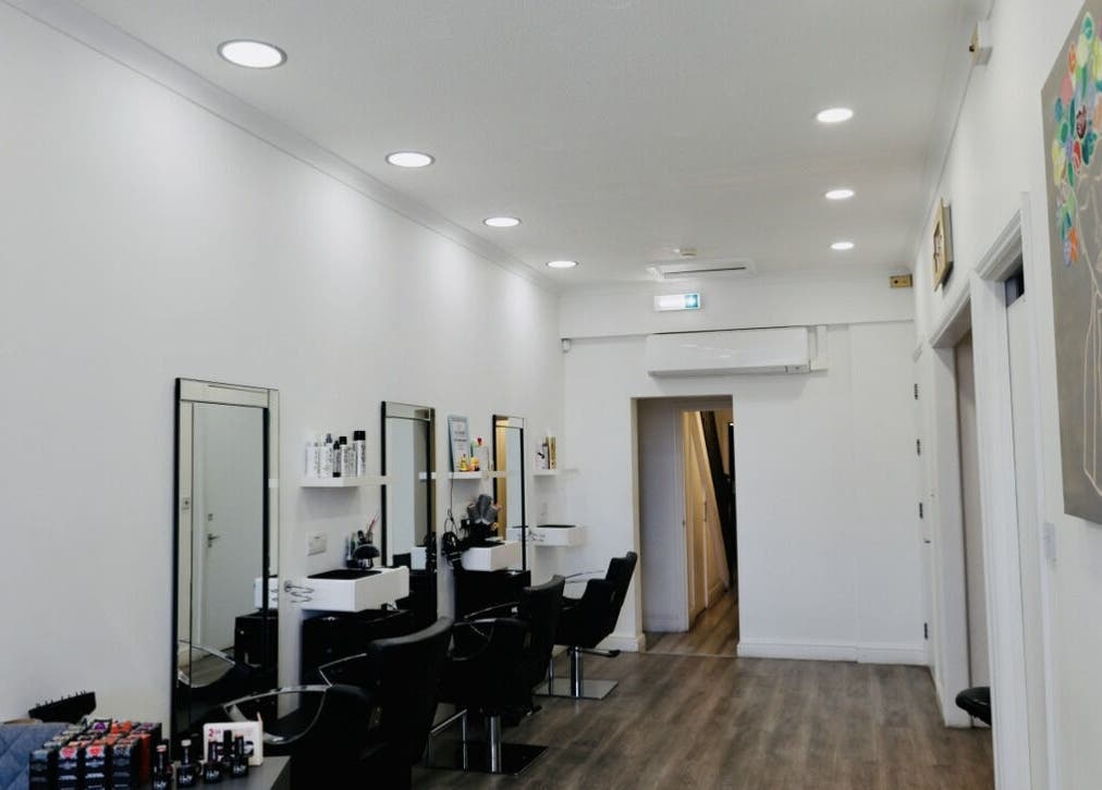 Modern salon chairs and mirrors at Sunrayz Hair & Beauty, Hornchurch, England, GB.