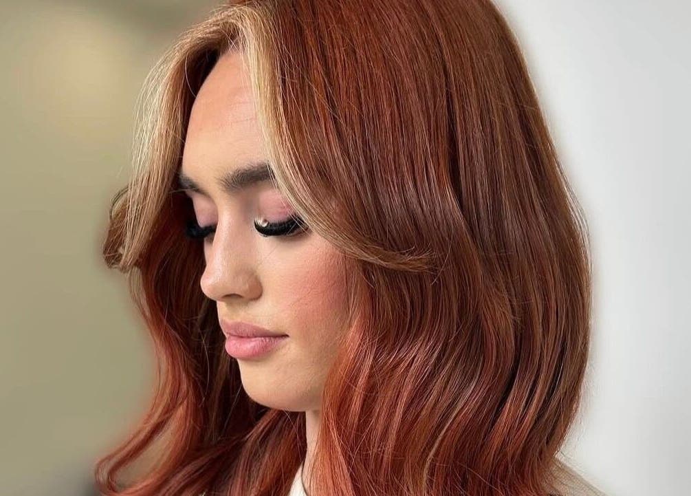 Elegant auburn hairstyle showcased at Sunrayz Hair & Beauty in Hornchurch, England, GB.