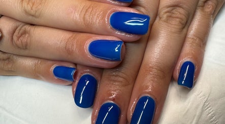 Vibrant blue manicure at Soothe & Glow, Bletchley, England, GB. Showcase of glossy nail art.