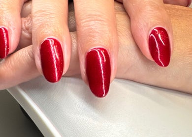 Elegant red manicure at Soothe & Glow, Bletchley, England, GB, showcasing impeccable nail artistry.