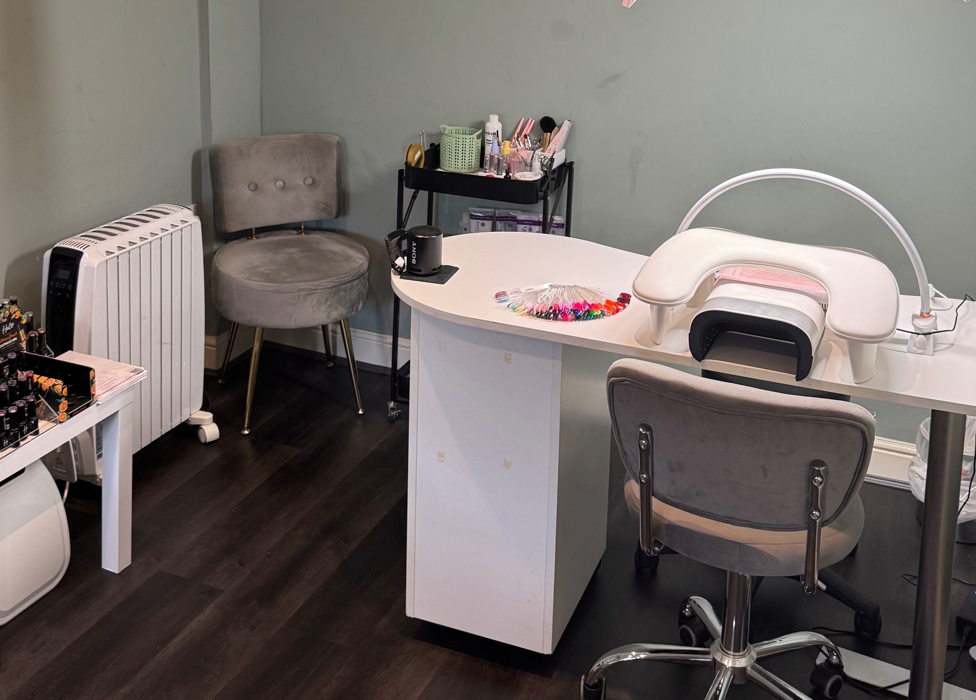 Soothe & Glow nail station in Bletchley, England, GB, featuring modern design and polish display.