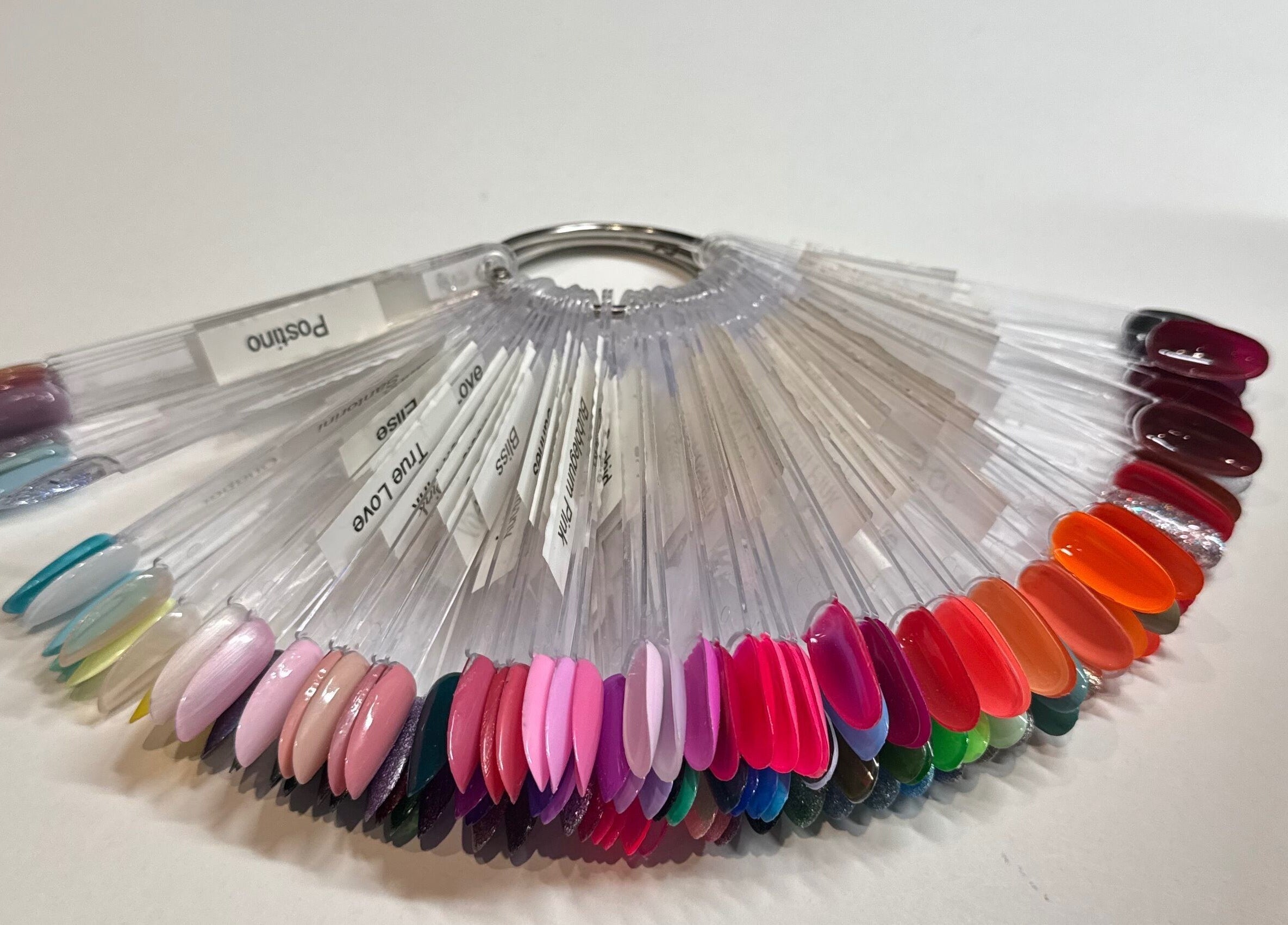 Colorful nail polish palette at Soothe & Glow, Bletchley, England, GB showcasing diverse shades.