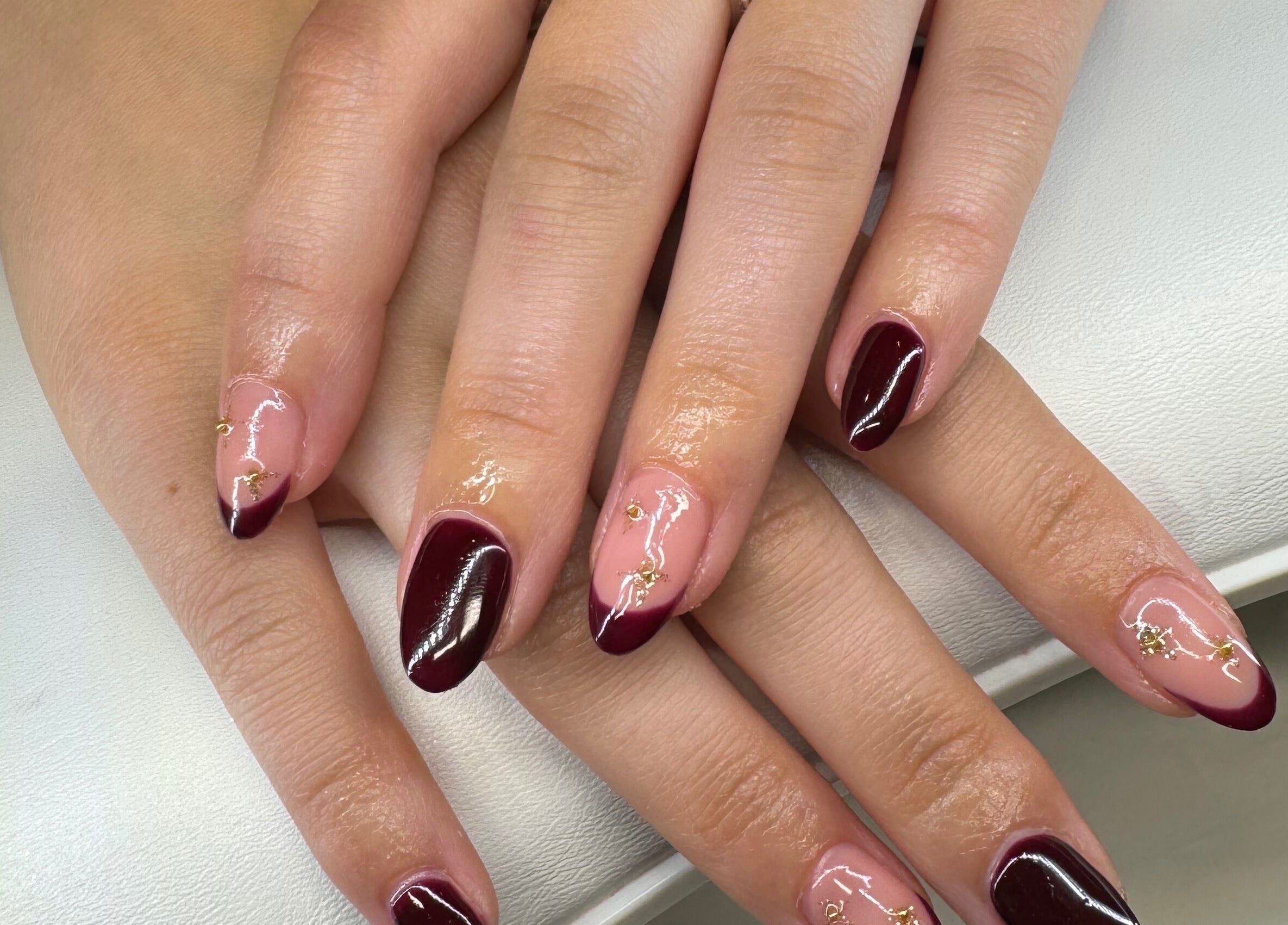 Chic burgundy nail art at Soothe & Glow, Bletchley, England, GB showcasing elegance and style.