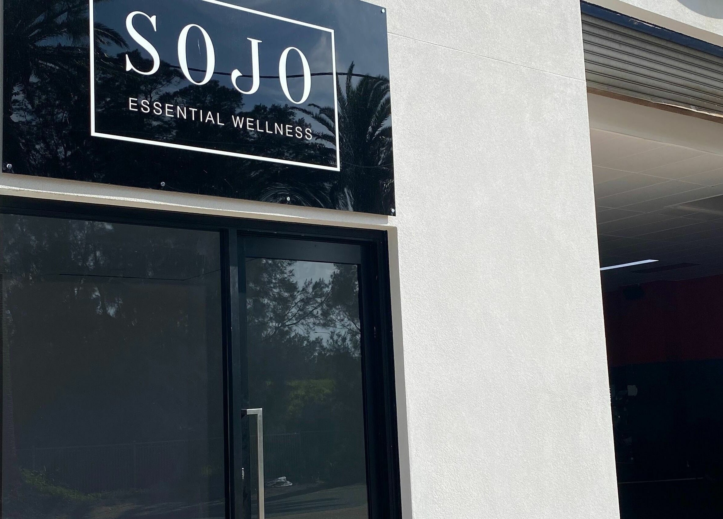 Front view of SOJO Essential Wellness entrance, Botany, NSW, AU, showcasing modern design.
