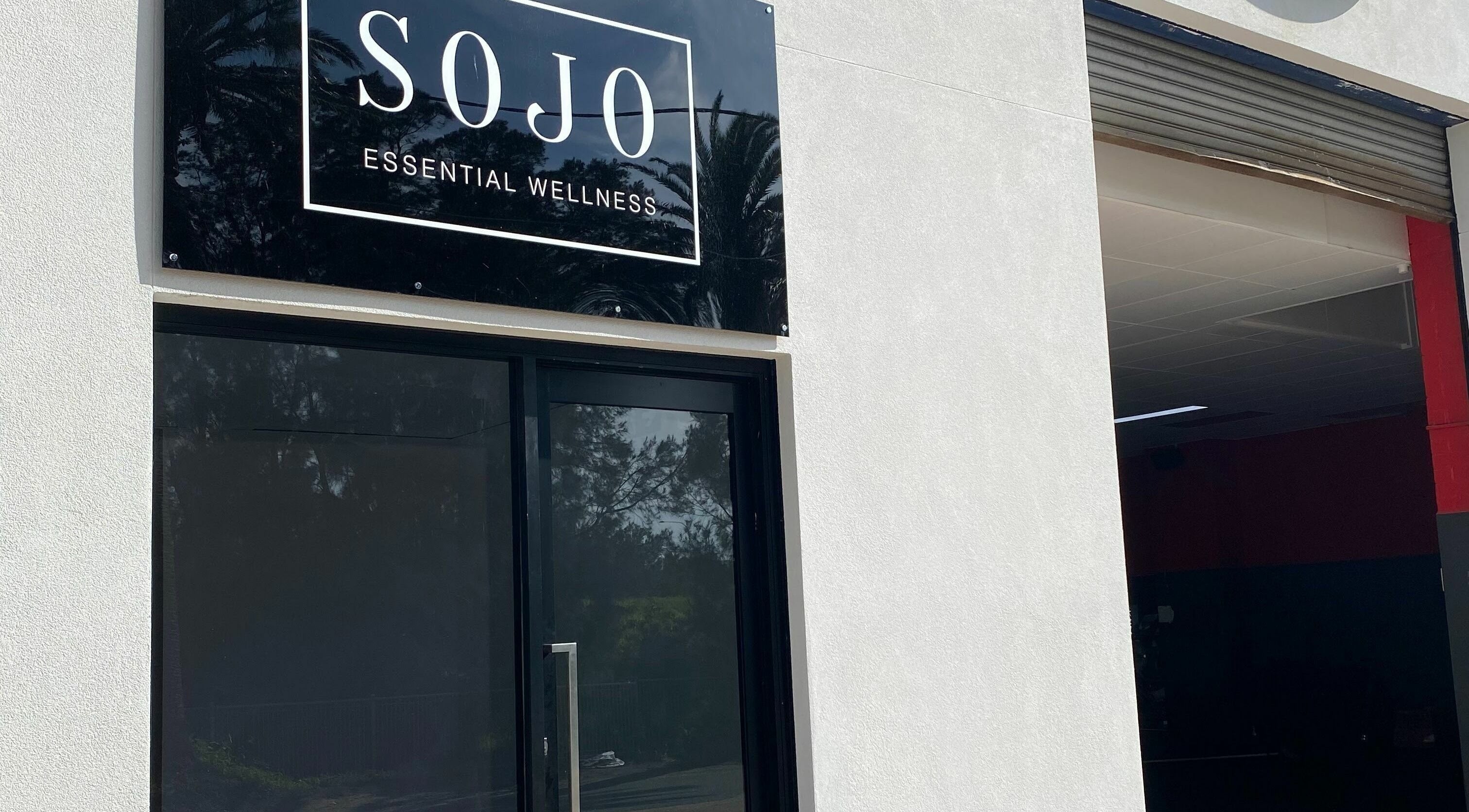 Front view of SOJO Essential Wellness entrance, Botany, NSW, AU, showcasing modern design.