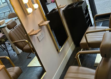 Luxurious beauty station at The Glambar, Glasgow, Scotland, GB, featuring elegant chairs and mirrors.