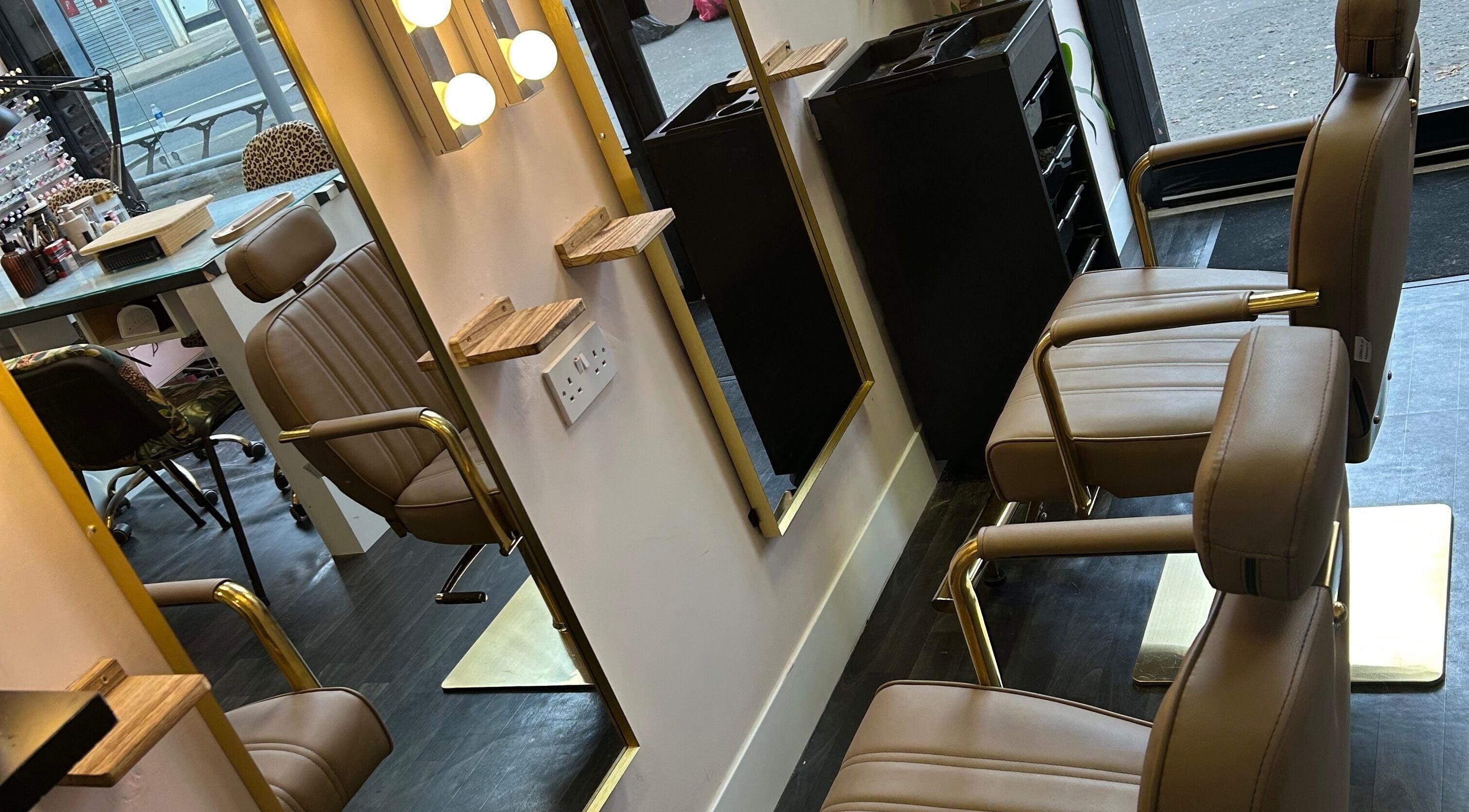 Luxurious beauty station at The Glambar, Glasgow, Scotland, GB, featuring elegant chairs and mirrors.