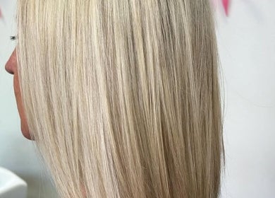Beautiful blonde hair styled seamlessly at The Glambar, Glasgow, Scotland, GB, showcasing expert hairdressing.