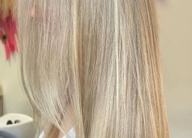 Close-up of sleek blonde hair styled at The Glambar, Glasgow, Scotland, GB salon.