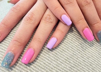 Vibrant manicured nails at ABBY NAIL SALON, Bangkok, TH, showcasing colorful nail art.
