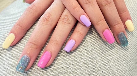 Vibrant manicured nails at ABBY NAIL SALON, Bangkok, TH, showcasing colorful nail art.