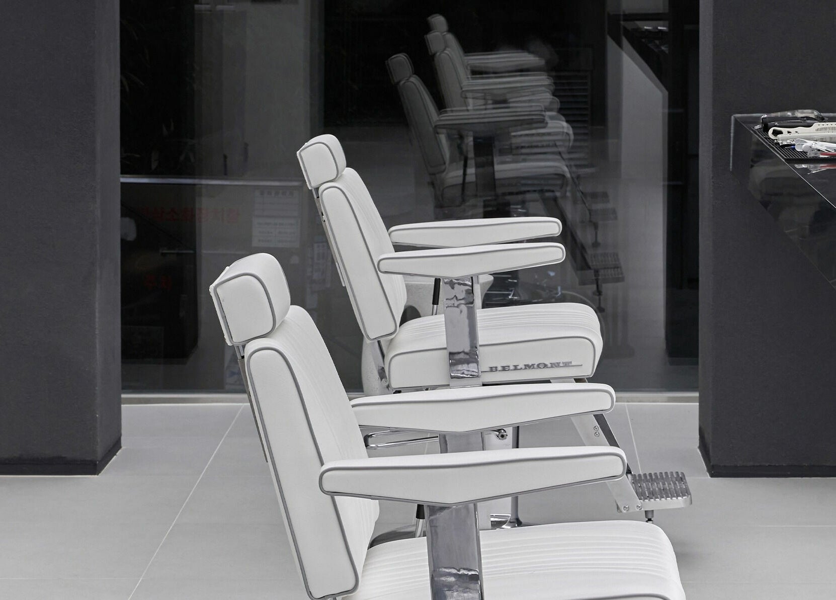 Modern white salon chairs at LEKKER Hongdae, Seoul, Seoul, KR, offering chic and comfortable styling.