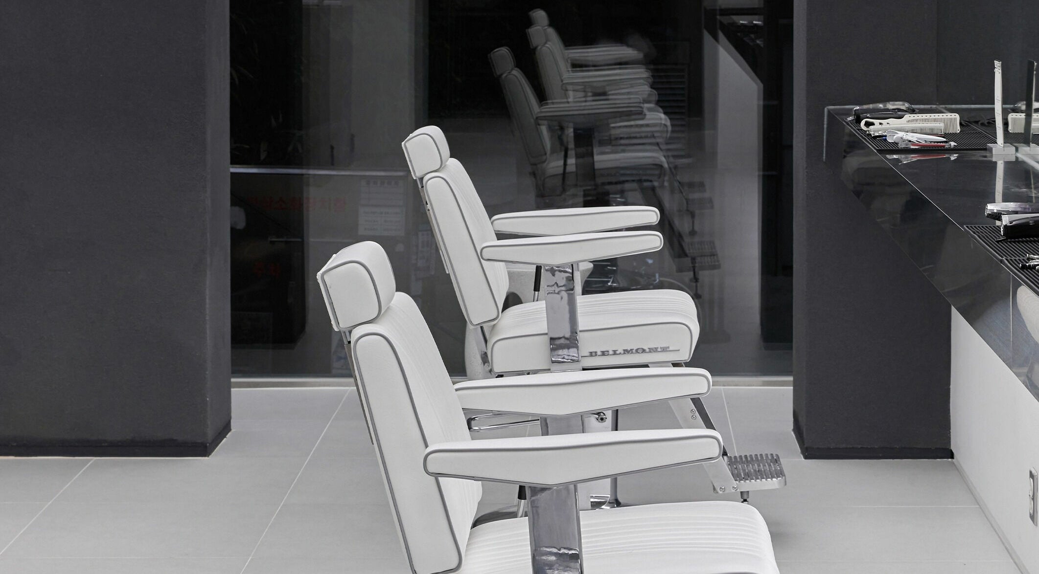 Modern white salon chairs at LEKKER Hongdae, Seoul, Seoul, KR, offering chic and comfortable styling.