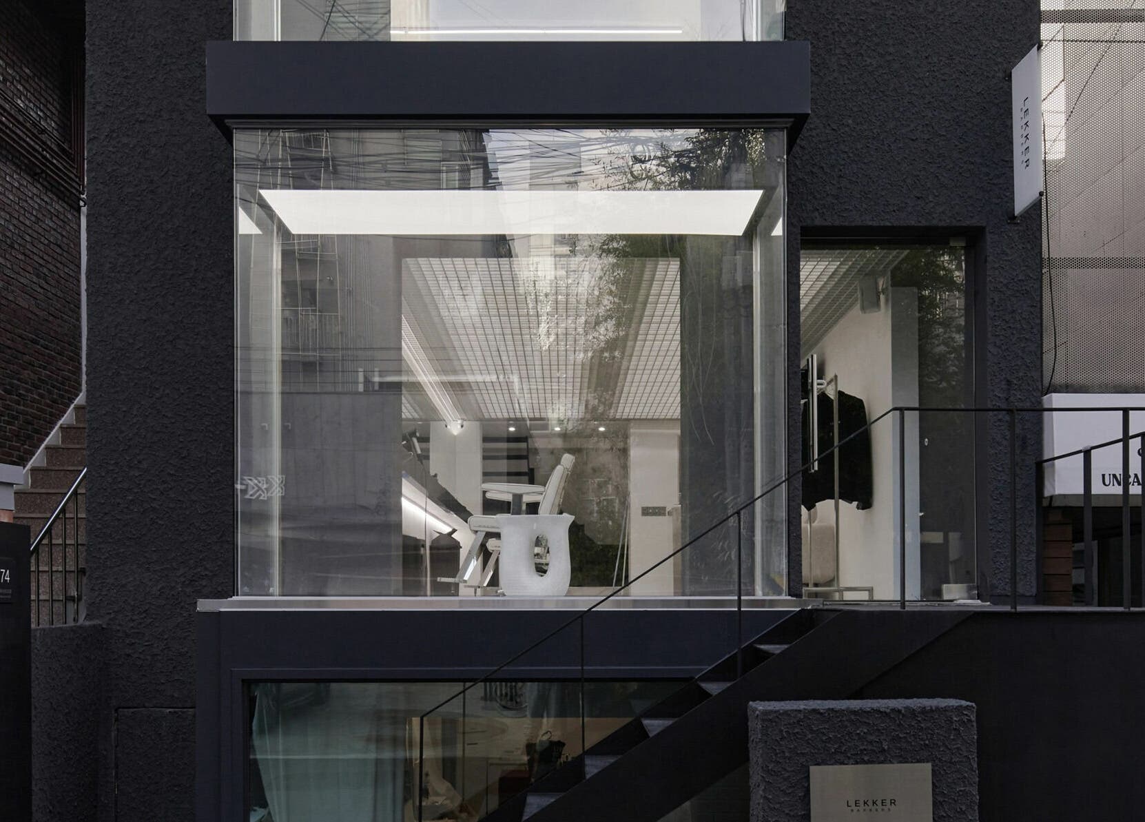 Modern exterior of LEKKER Hongdae with glass facade in Seoul, Seoul, KR offering beauty and wellness services.