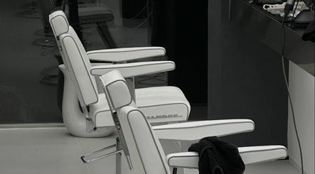 Modern white salon chairs at LEKKER Itaewon, Seoul, Seoul, KR, offering premium hair services.