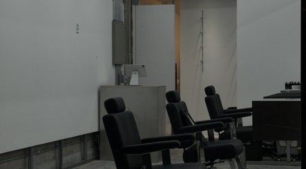 Modern salon chairs at LEKKER Gangnam, located in Seoul, Seoul, KR, highlighting a minimalist decor.
