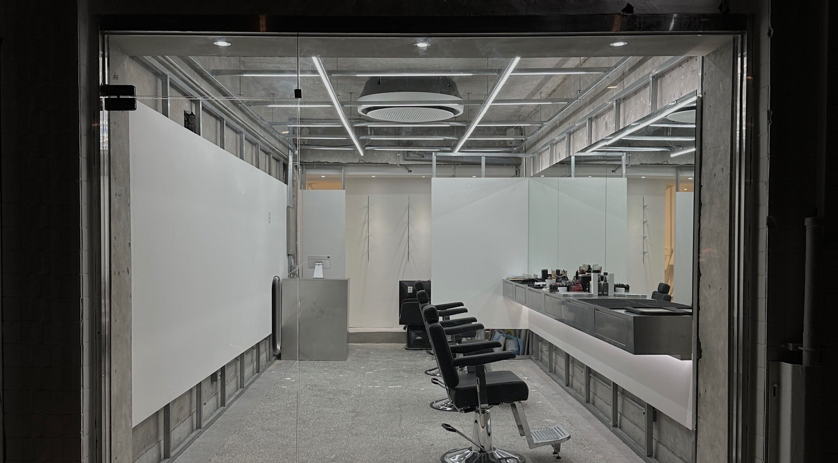 Modern barber chairs and a sleek design at LEKKER Gangnam, seoul, seoul, KR, creating an elegant environment.