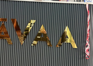 Avaa_Kandivali logo on elegant front desk in Mumbai, Maharashtra, IN.
