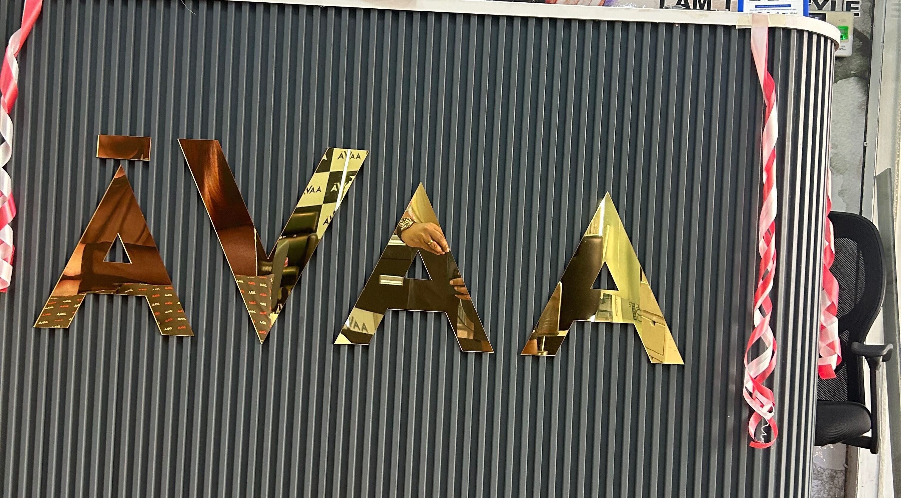 Avaa_Kandivali logo on elegant front desk in Mumbai, Maharashtra, IN.