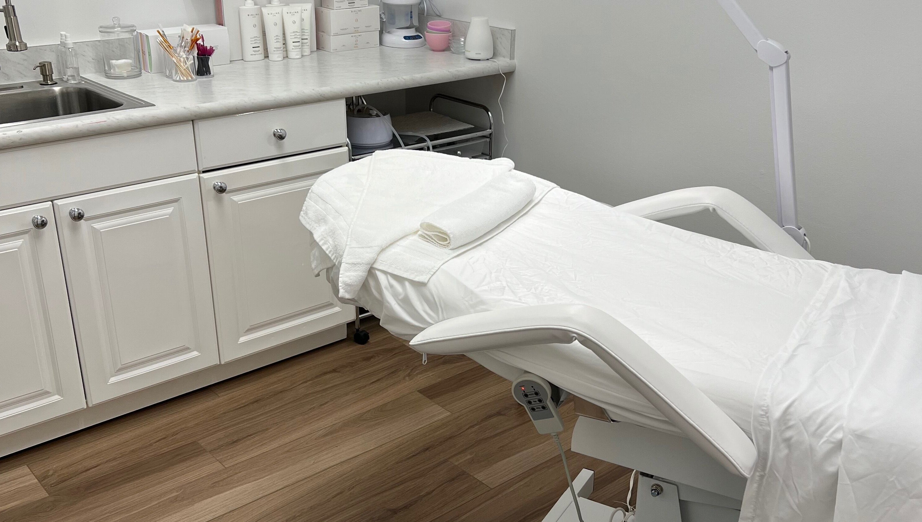 Treatment room at Caroline Krutzsch - Waxing & Brow Studio in Bonita Springs, Florida, US featuring a comfortable spa bed.