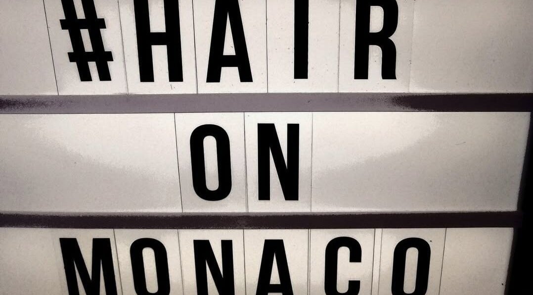 Illuminated sign displaying 'Hair on Monaco' in Zilzie, Australia, AU. A beacon for beauty seekers.