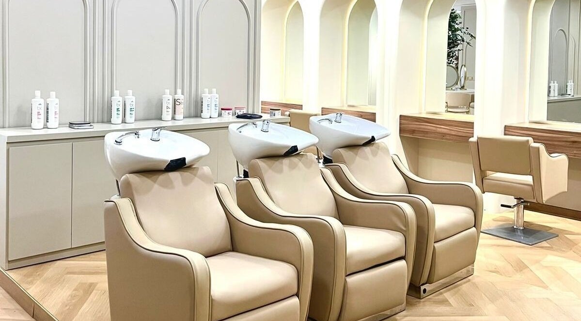 Luxurious hair wash stations at La Beauté, Dubai, AE, featuring sleek contemporary design and comfort.