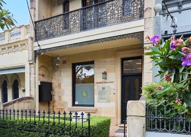 Charming facade of Angelina Samko in Bondi Junction, New South Wales, AU, with intricate ironwork and lush greenery.