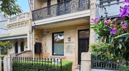 Front exterior of Angelina Samko at Bondi Junction, New South Wales, AU, featuring ornate ironwork and lush greenery.