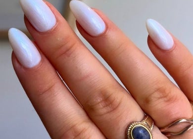 Elegant white nails at Gosh Beauty (Gosh Nails 2nd Branch), Stellenbosch, Western Cape, ZA with stylish rings.