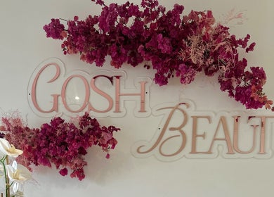 Gosh Beauty sign with vibrant flowers at Gosh Nails 2nd Branch, Stellenbosch, Western Cape, ZA.