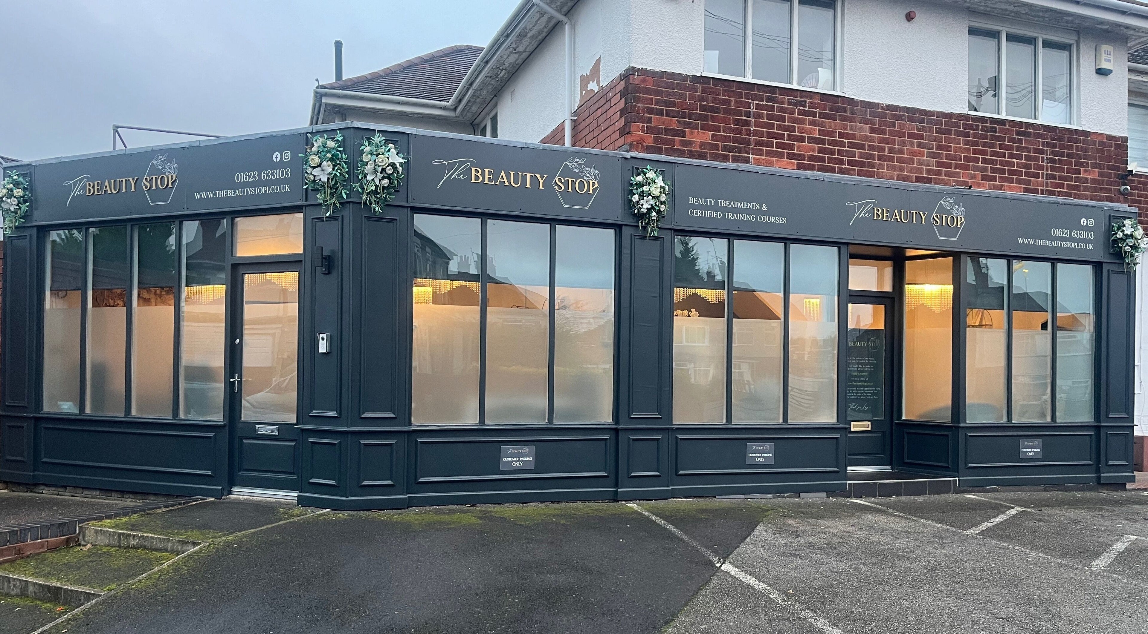The Beauty Stop's stylish exterior in Mansfield, England, GB featuring sleek black paneling.