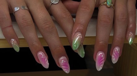 Colorful nail art at Amour Nails by Baya, Port Macquarie, New South Wales, AU with pink and green designs.
