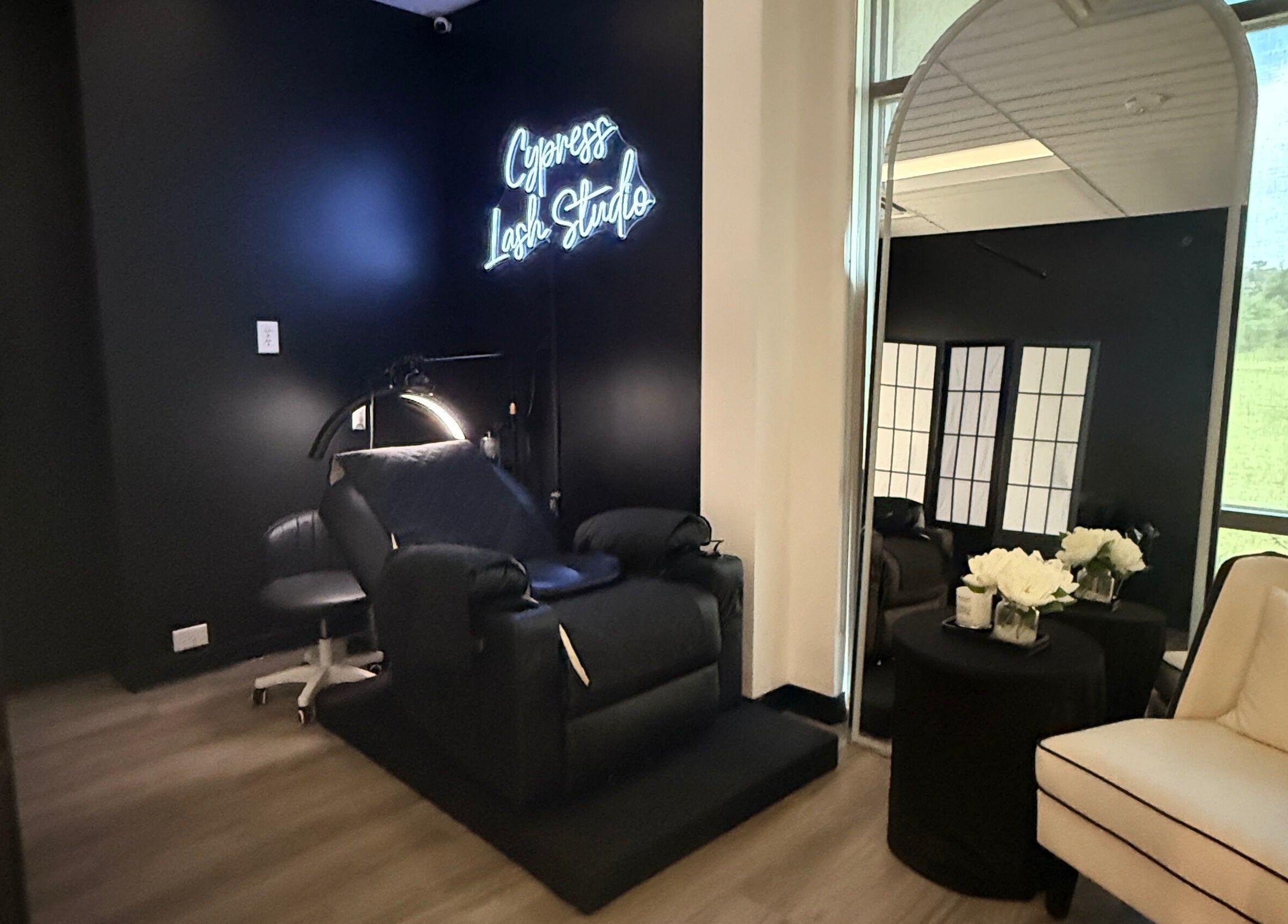 Sleek interior of Cypress Lash Studio in Cypress, Texas, US, featuring a plush chair and elegant decor.