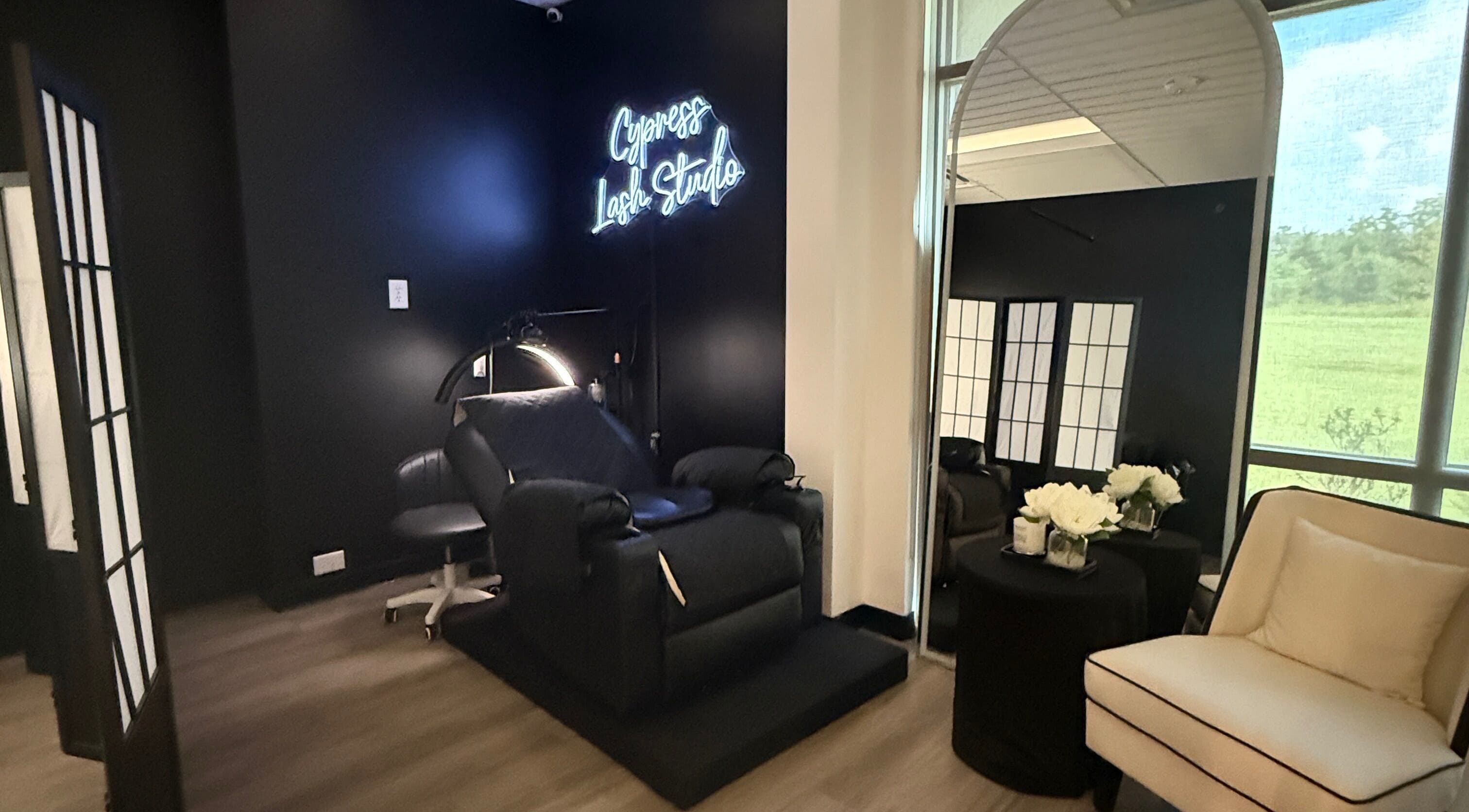 Sleek interior of Cypress Lash Studio in Cypress, Texas, US, featuring a plush chair and elegant decor.