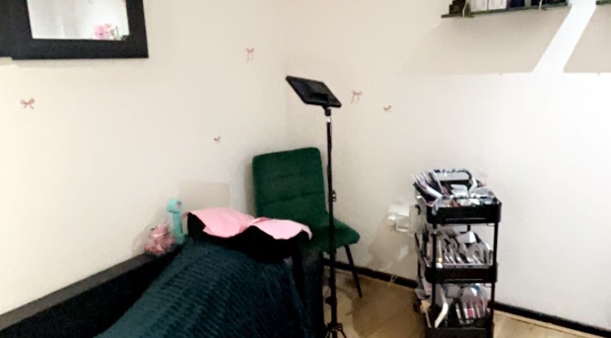 Beauty treatment room at Created By Leenah, Purfleet, England, GB with a cozy setup and organized supplies.