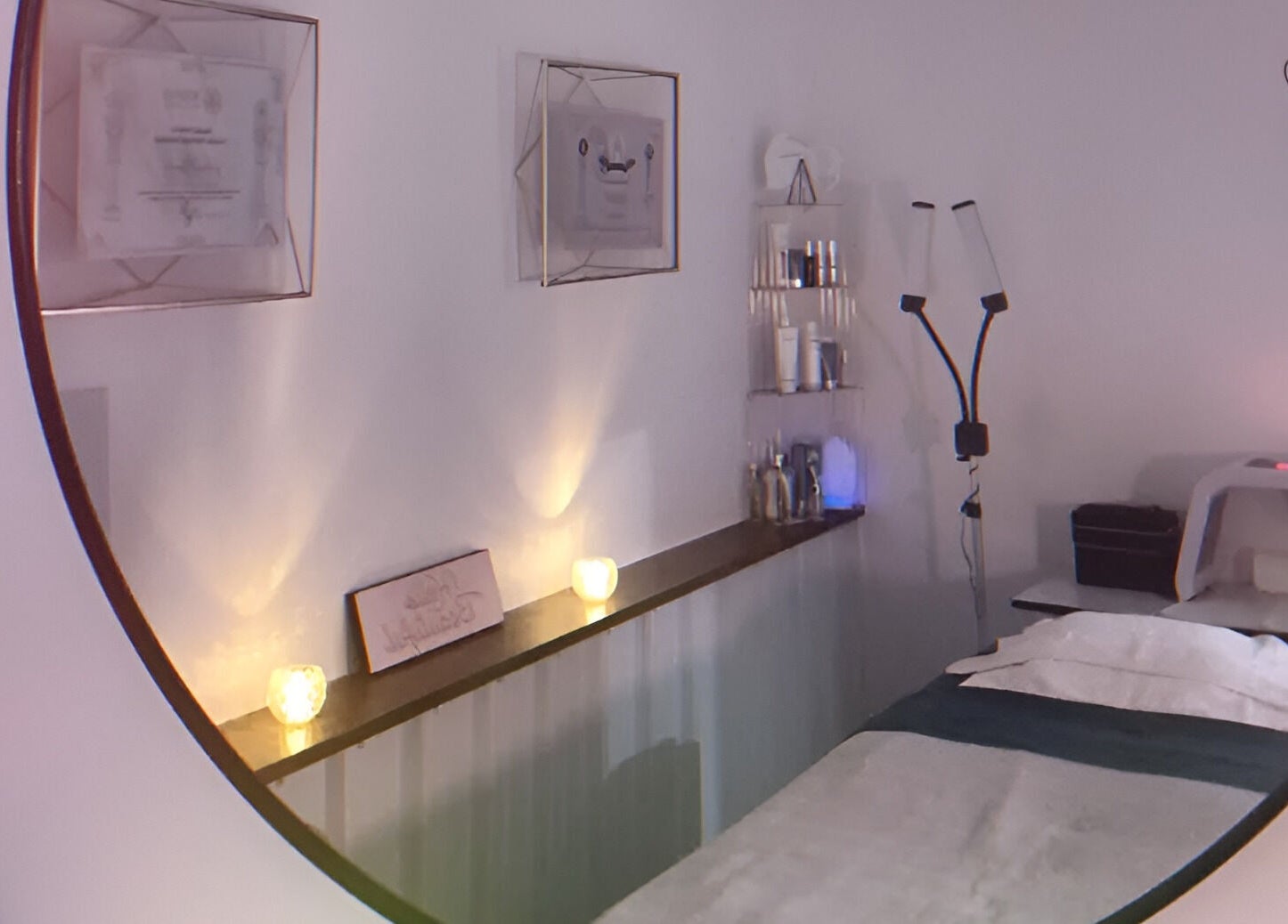 Cozy treatment room at Lainey Everett Aesthetics, Whangaparāoa, Auckland, NZ, with warm lighting and a tranquil vibe.