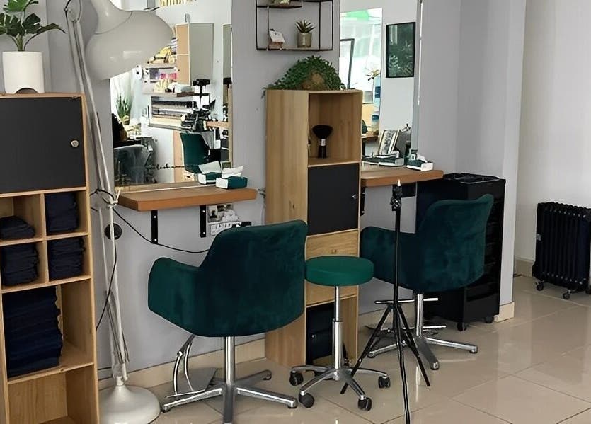 Elegant styling area at Morgan Brown Hair And Beauty Ltd in Weymouth, England, GB featuring modern décor.