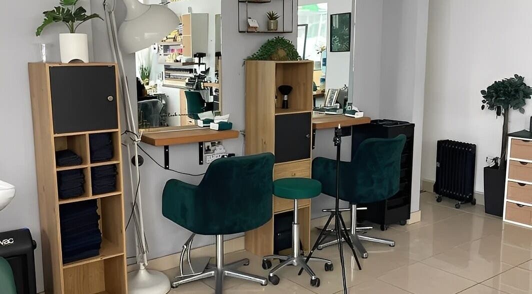 Elegant styling area at Morgan Brown Hair And Beauty Ltd in Weymouth, England, GB featuring modern décor.