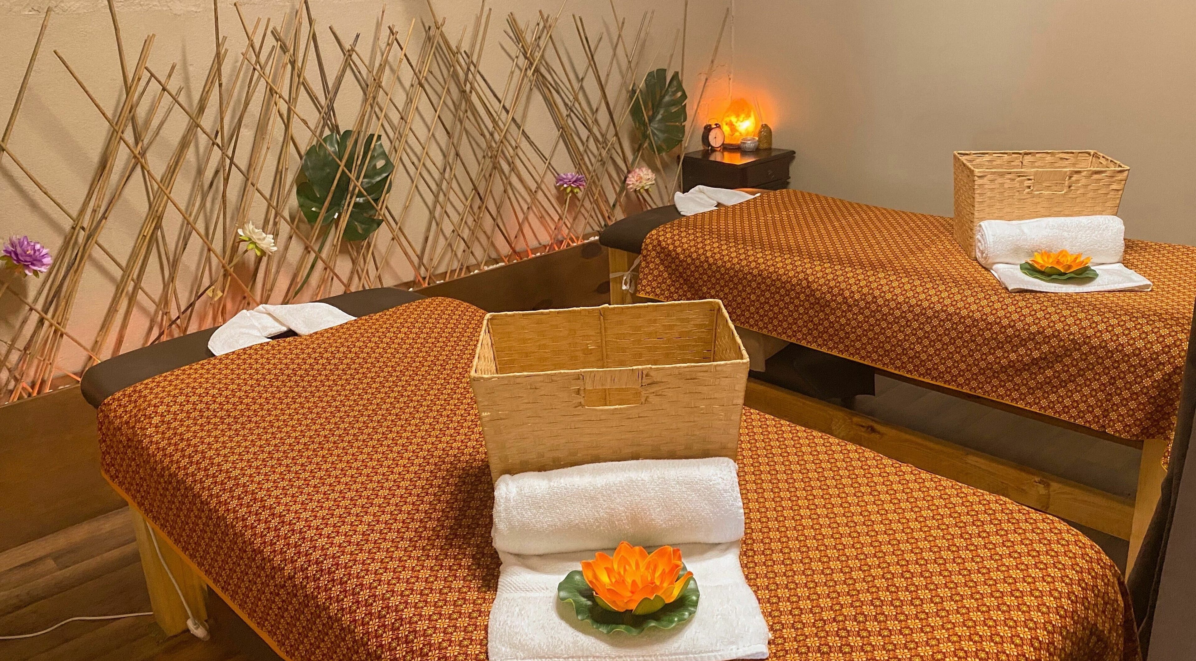 Tranquil massage room at Forget Me Not Thai Massage, Melbourne, Victoria, AU, with bamboo accents and lotus decor.