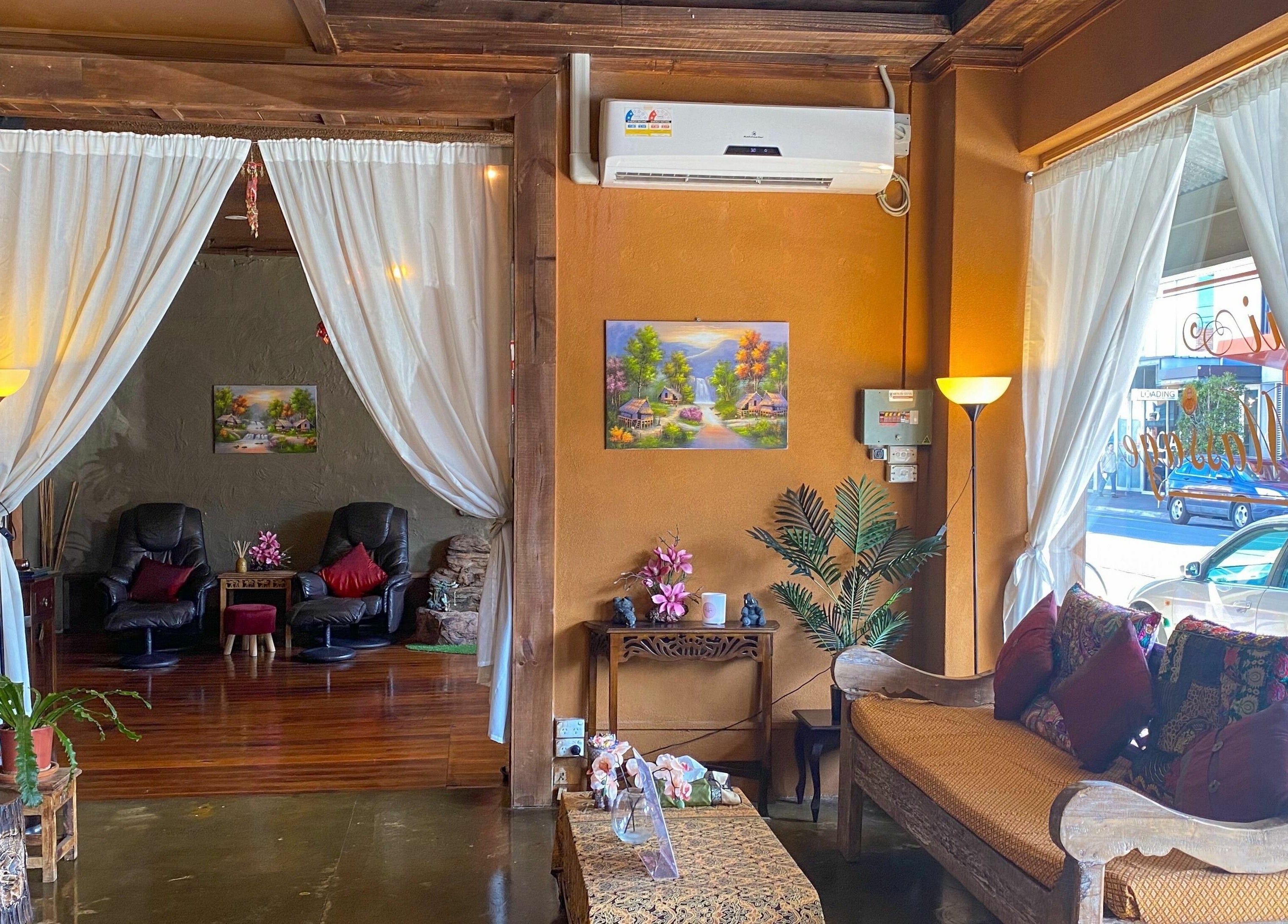 Cozy interior of Forget Me Not Thai Massage in Melbourne, Victoria, AU with plush seating and calming decor.