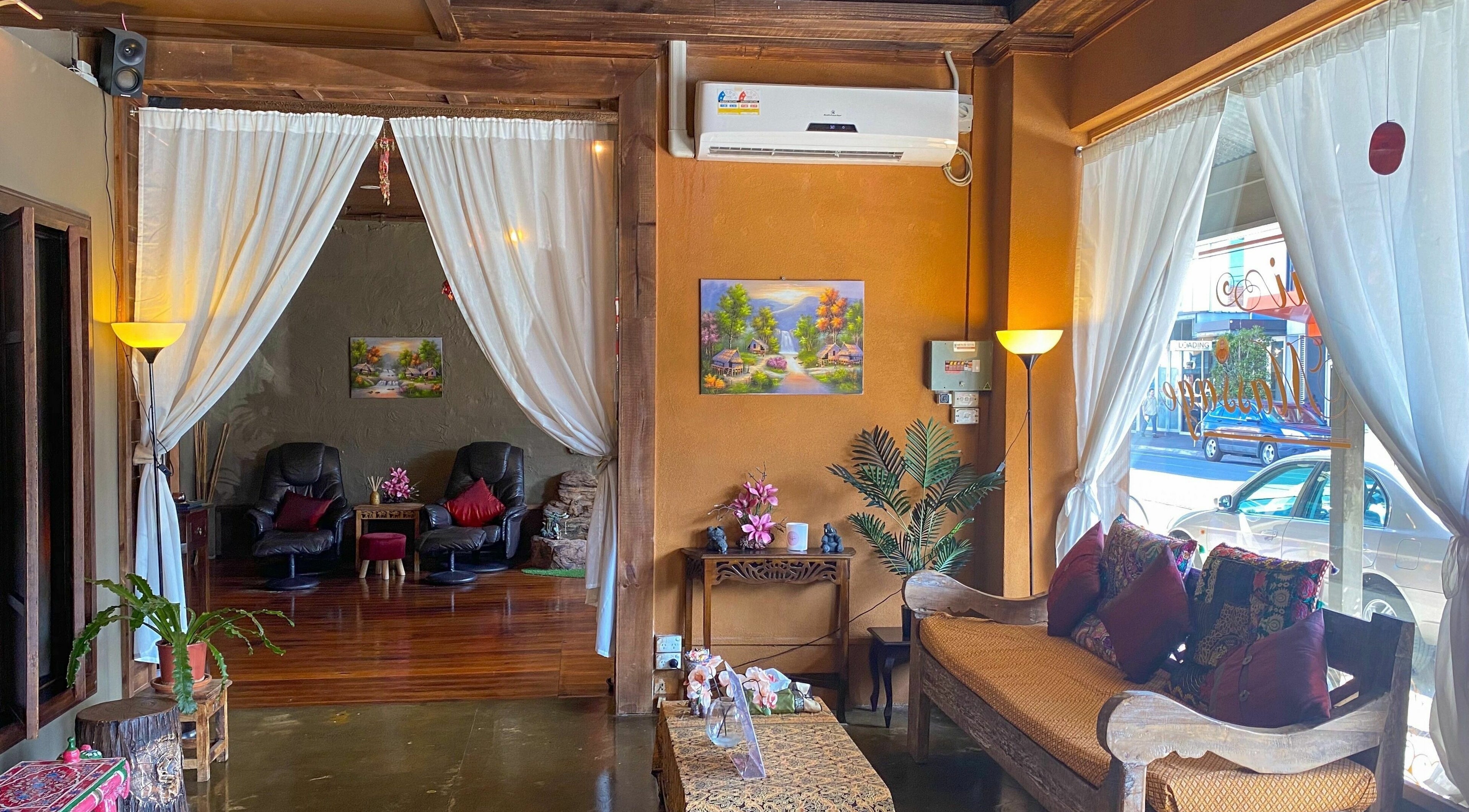 Cozy interior of Forget Me Not Thai Massage in Melbourne, Victoria, AU with plush seating and calming decor.