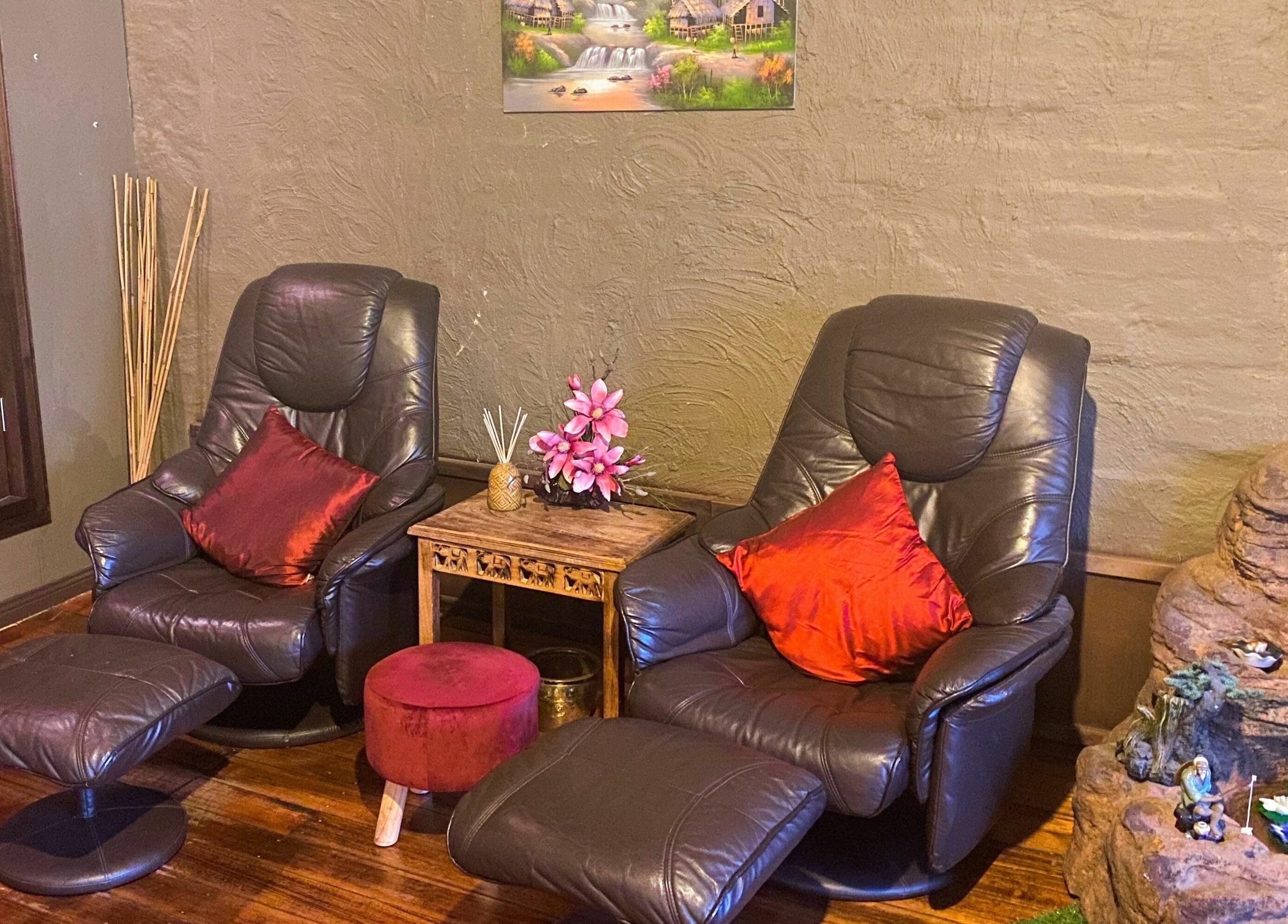 Cozy leather chairs in tranquil setting at Forget Me Not Thai Massage, Melbourne, Victoria, AU.