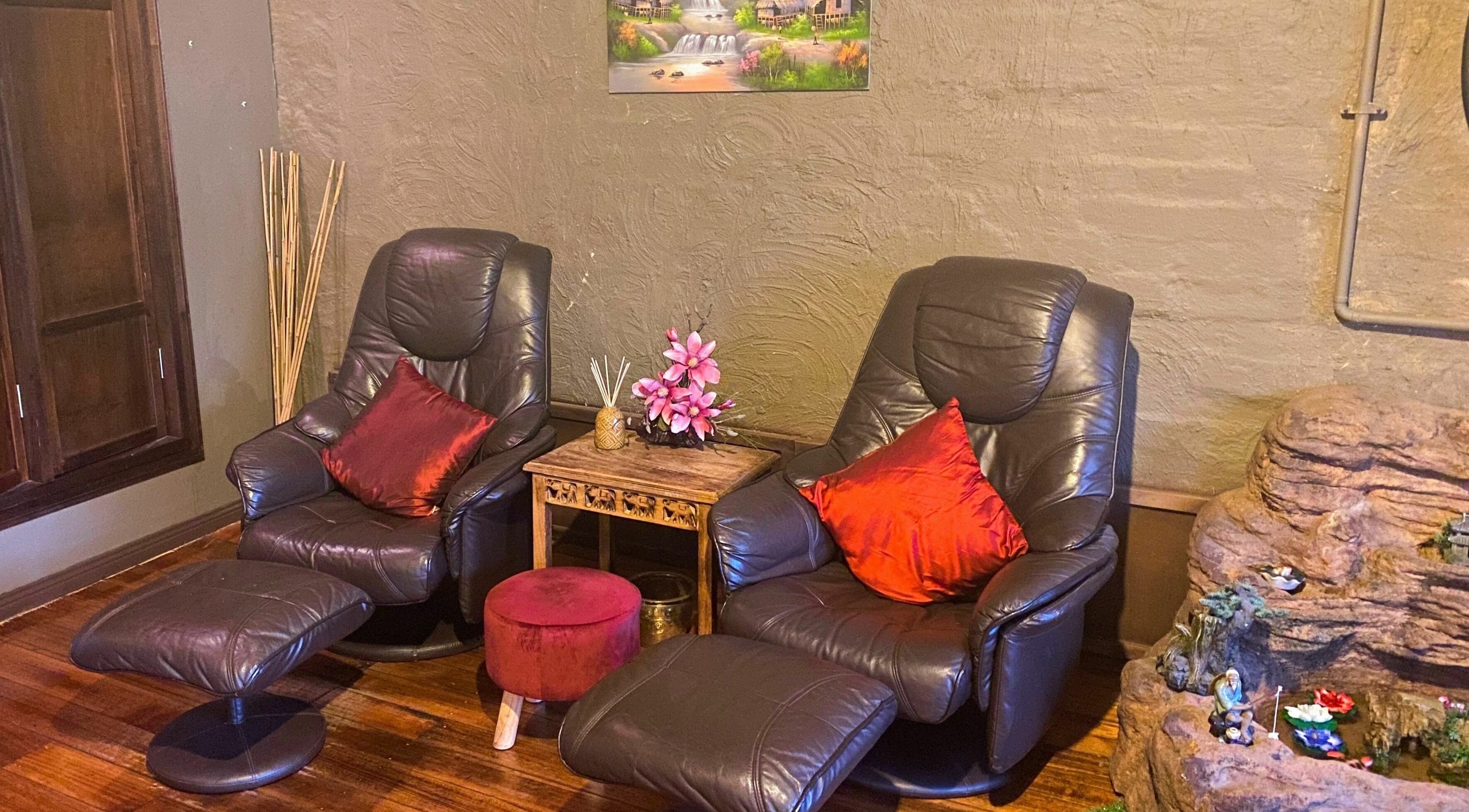 Cozy leather chairs in tranquil setting at Forget Me Not Thai Massage, Melbourne, Victoria, AU.