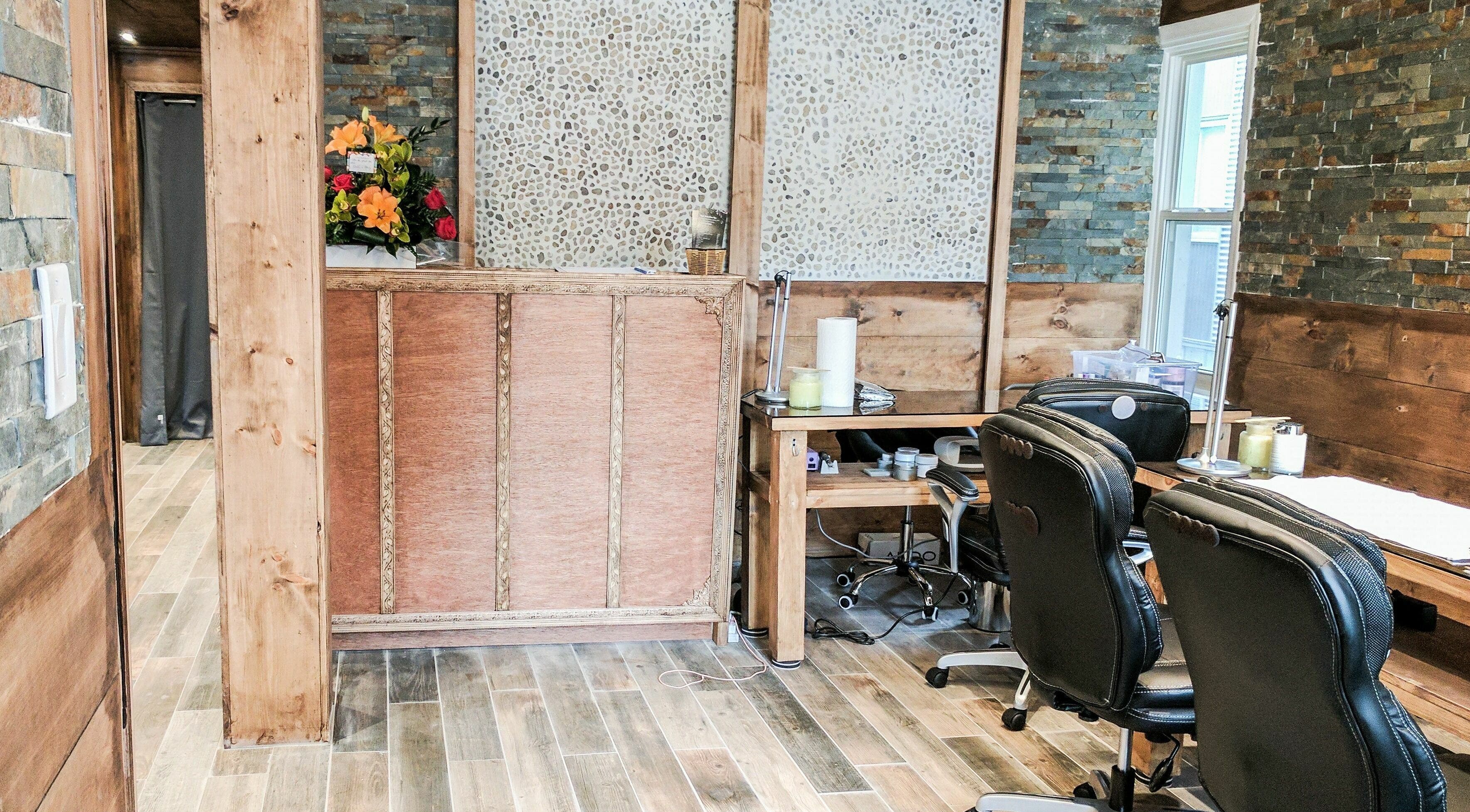 Stylish interior of High Definition Spa in Ottawa, Ontario, CA featuring rustic wood and stone decor.