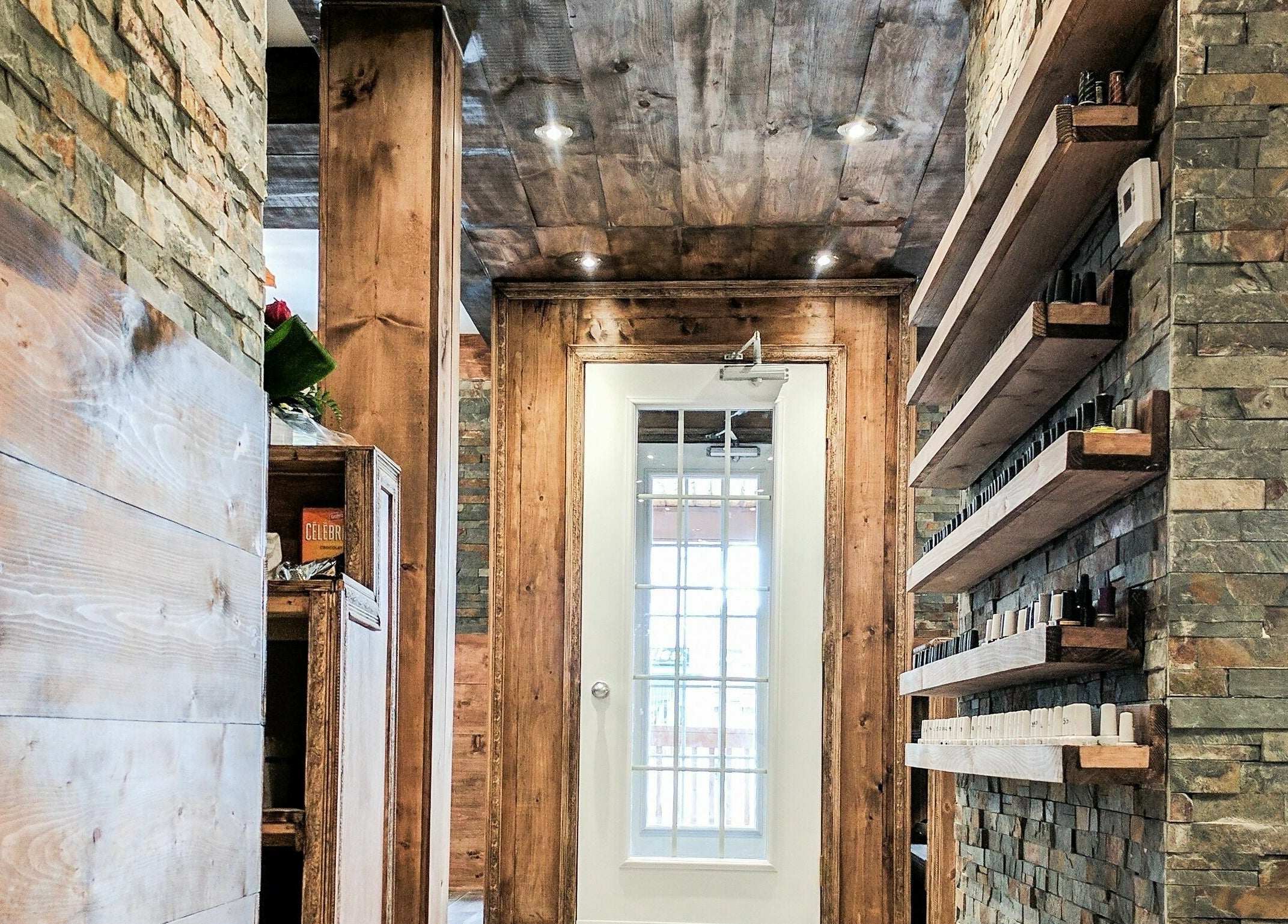 Elegant rustic interior of High Definition Spa in Ottawa, Ontario, CA featuring wooden and stone textures.