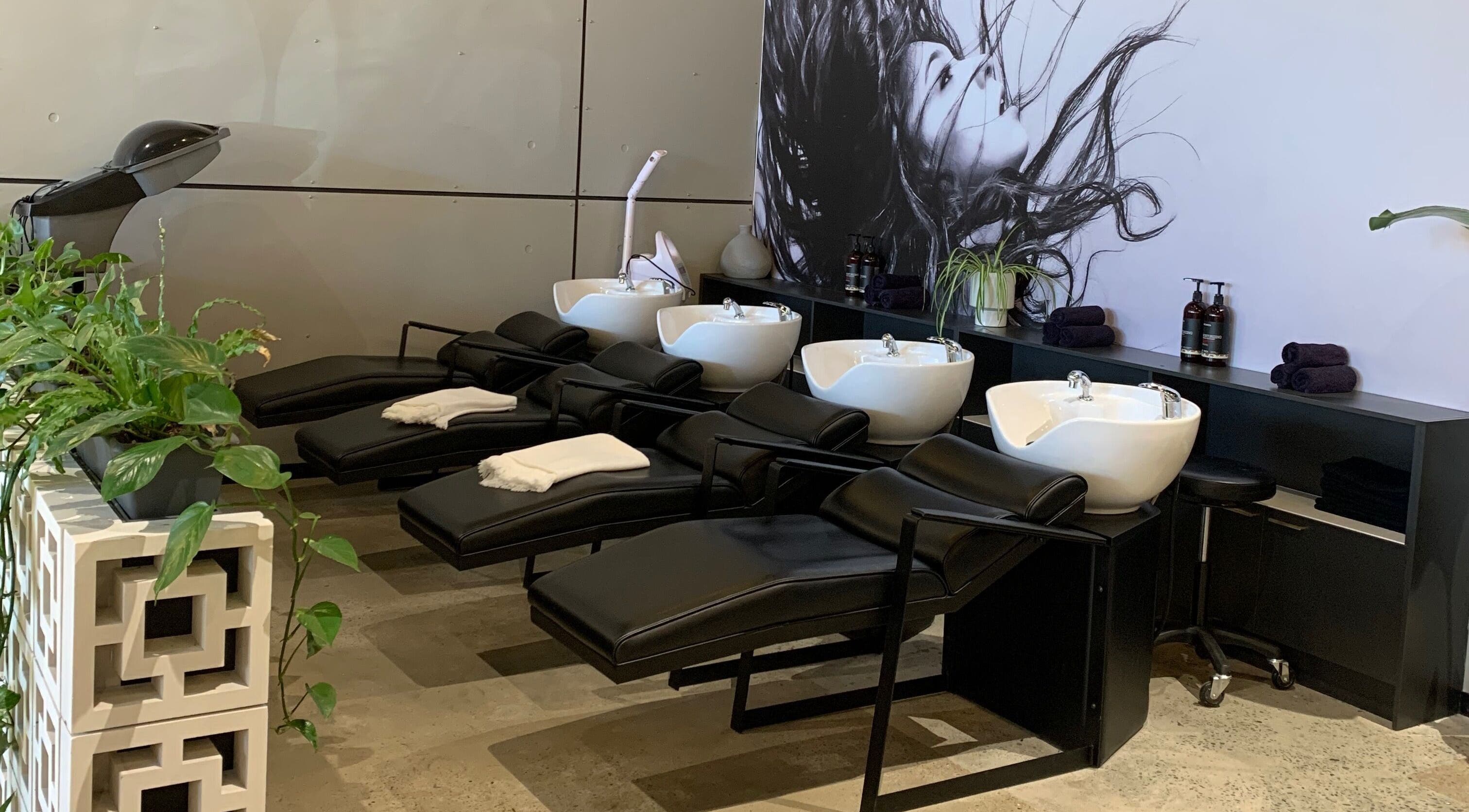 Sleek wash stations at Joanna Panos Hairdressing at Botanica, Southport, Queensland, AU, offering luxury services.