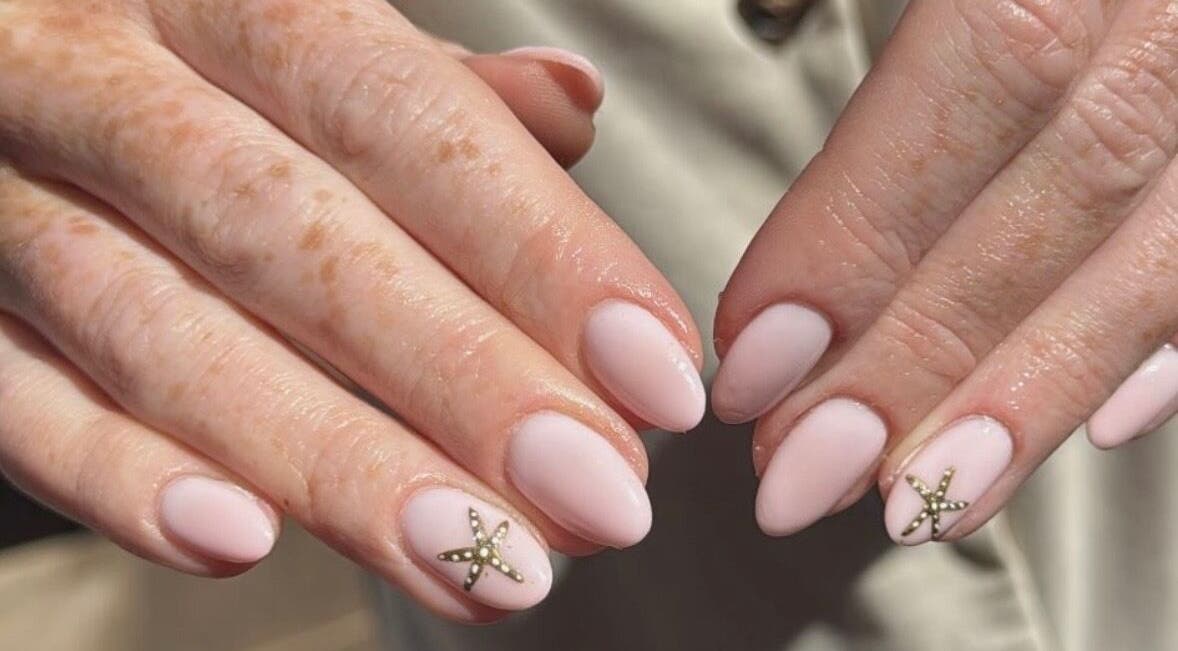 Elegant pink manicure with starfish design at Salon 33 by Ellie, Barrowford, England, GB.